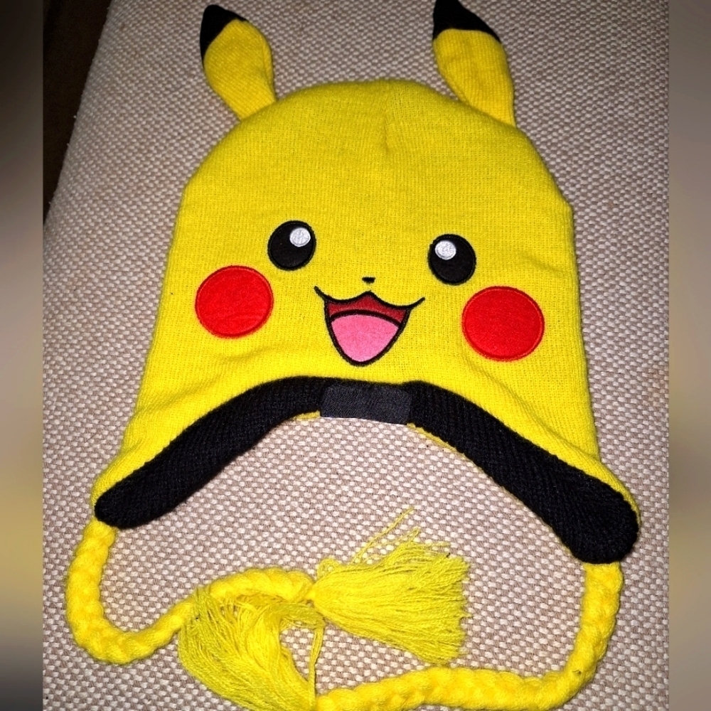 A Pikachu toboggan with ears and straps. Pokemon, like new.